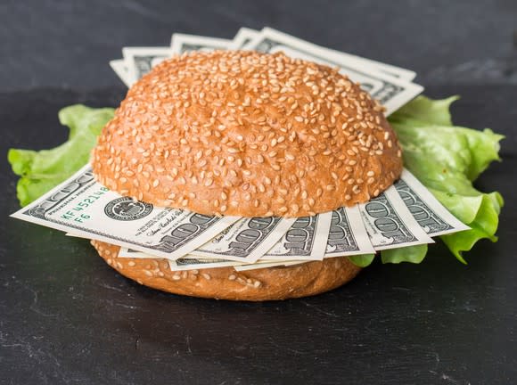 Burger bun with $100 bills instead of meat