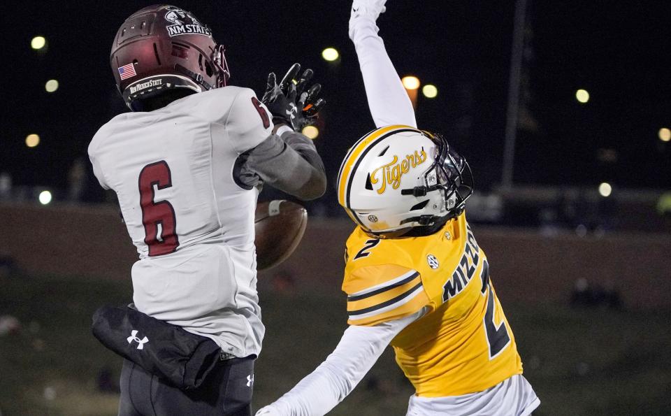 Nov 19, 2022; Columbia, Missouri, USA; Missouri Tigers defensive back Ennis Rakestraw Jr. (2) breaks up a pass intended for New Mexico State Aggies wide receiver Justice Powers (6) during the first half at Faurot Field at Memorial Stadium. Mandatory Credit: Denny Medley-USA TODAY Sports