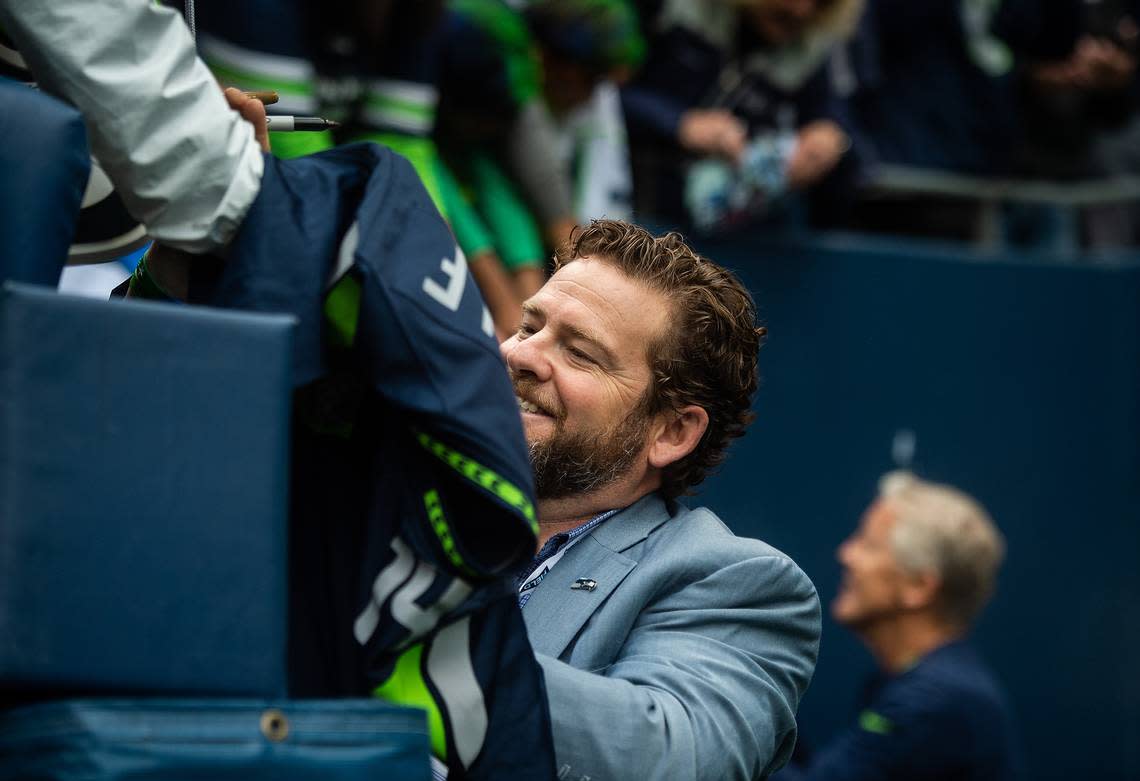 General Manager John Schneider signs autographs before the game. The Seattle Seahawks played the Cincinnati Bengals in an NFL game at CenturyLink Field in Seattle, Wash., on Sunday, Sept. 8, 2019.