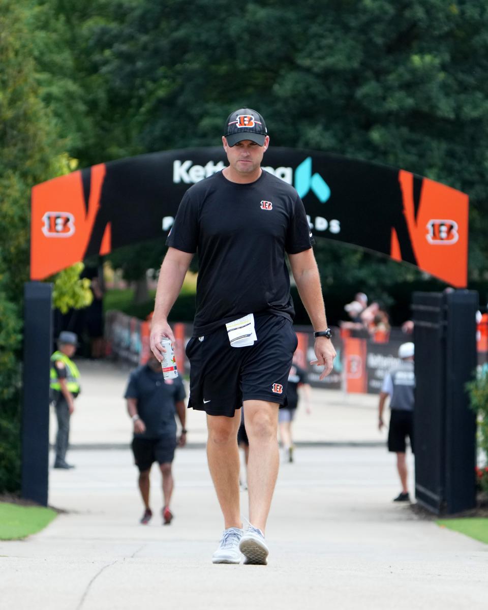 Cincinnati Bengals head coach Zac Taylor walks to the field ahead of NFL training camp practice, Monday, July 31, 2023, in Cincinnati.
