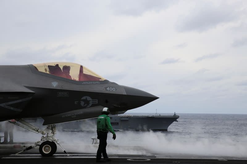 United States Seventh Fleet prepares a F-35 stealth fighter for take-off aboard USS Carl Vinson, in the Pacific Ocean