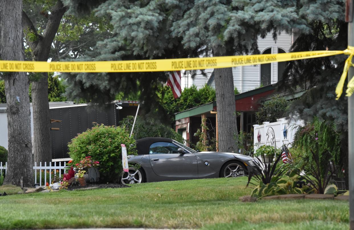 Police search the home of Gilgo Beach murder suspect Rex Heuermann.