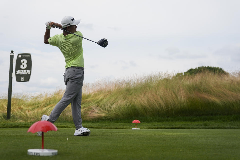 Collin Morikawa hits from the third tee during the third round of the Travelers Championship golf tournament at TPC River Highlands, Saturday, June 22, 2024, in Cromwell, Conn. (AP Photo/Seth Wenig)