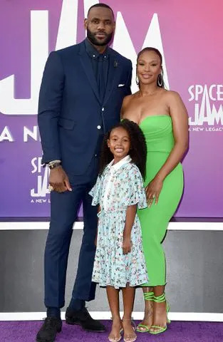 <p>Axelle/Bauer-Griffin/FilmMagic</p> LeBron James, Savannah Brinson and Zhuri James attend the Premiere of Warner Bros "Space Jam: A New Legacy" on July 12, 2021 in Los Angeles, California.