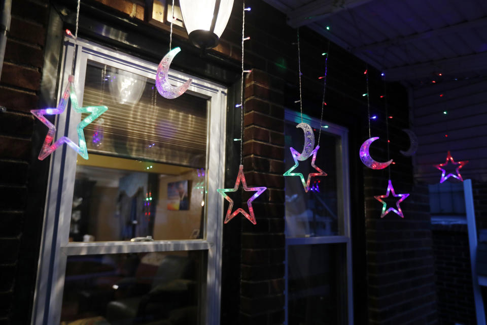 In this Tuesday, April 28, 2020 photo, Ramadan lights are displayed on a house in Dearborn, Mich. The Muslim community in Dearborn is starting a new tradition this year. The community is hosting a Ramadan lights competition in hopes of spreading joy and bringing back some of the holiday spirit during the coronavirus pandemic. (AP Photo/Carlos Osorio)