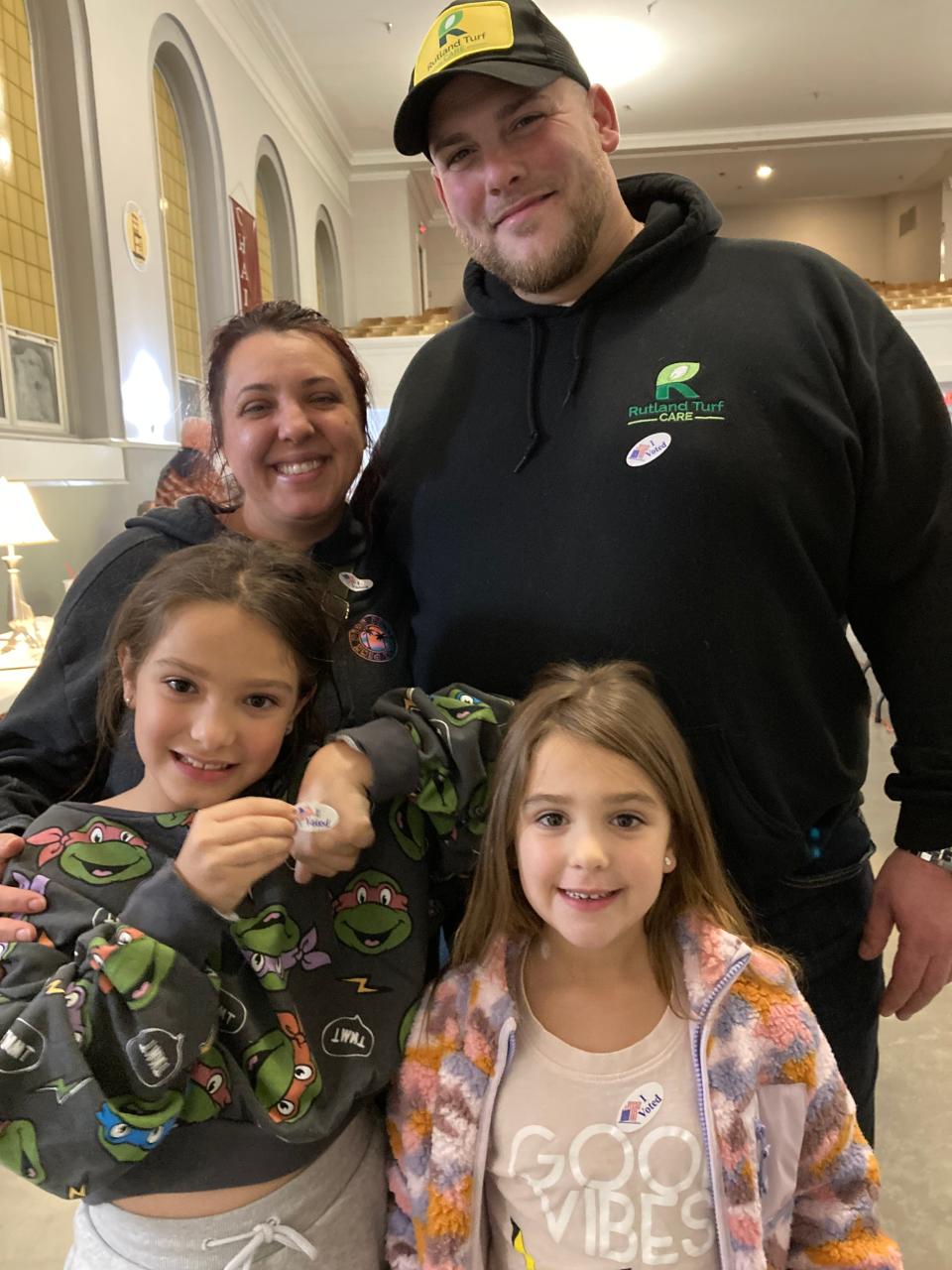 Kevin Schofield and Claudia Gulino brought their daughters Karina, 8, and Chiara, 5 to help them vote in Gardner.