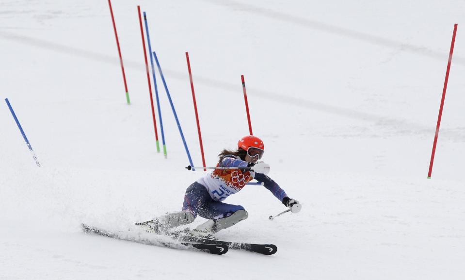 Bronze medal winner United States' Julia Mancuso passes a gate in the slalom portion of the women's supercombined at the Sochi 2014 Winter Olympics, Monday, Feb. 10, 2014, in Krasnaya Polyana, Russia. (AP Photo/Christophe Ena)