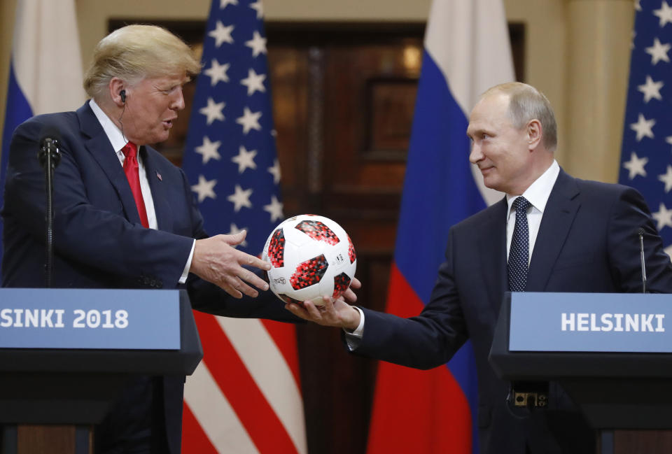 Russian President Vladimir Putin gives a soccer ball to President Trump after their meeting in Helsinki, Finland, July 16, 2018. (Photo: Alexander Zemlianichenko/AP)