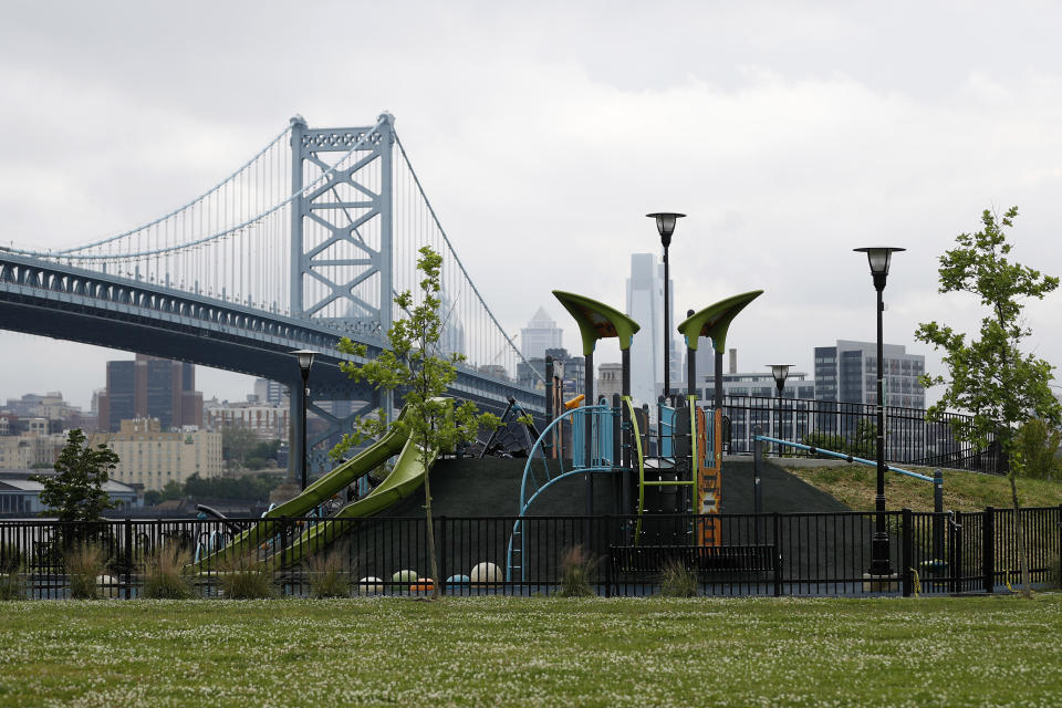 This June 11, 2020, photo shows Cooper's Poynt Park in Camden, N.J. The neighborhood, long one of the poorest and most dangerous in Camden, shows signs of progress. The state prison that graced the nearby waterfront has been replaced with a park. Aging schools, some now run by charter companies, have been spruced up. (AP Photo/Matt Slocum)