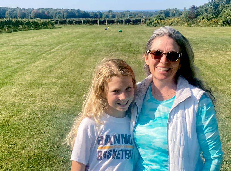 Keziah Swan, 10, poses with her mother, Stacy Swan, in the backyard of their family's North East Township home on Sept. 22. Keziah Swan, who like her older siblings began to learn how to golf on their expansive property, recently qualified for the 2024 Drive, Chip and Putt Championship. She'll compete in the girls age 10-11 division of the competition, which is scheduled next April 7 at Augusta (Georgia) National Golf Club. It will take place the weekend before the Masters.