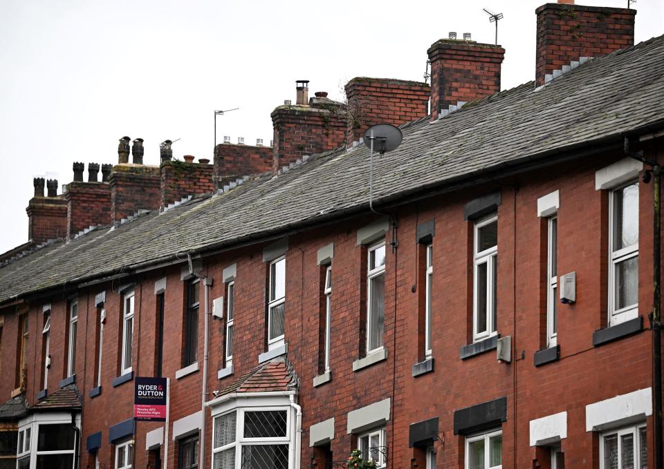 Houses are pictured in a rows of terraced homes on a residential street in Lees near Oldham, northern England on November 2, 2022. (Photo by Oli SCARFF / AFP) (Photo by OLI SCARFF/AFP via Getty Images)