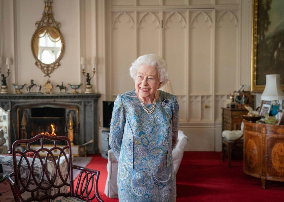 Queen Elizabeth II smiles while receiving the President of Switzerland Ignazio Cassis and his wife Paola Cassis during an audience at Windsor Castle in Windsor, England, Thursday, April 28, 2022. (AP)