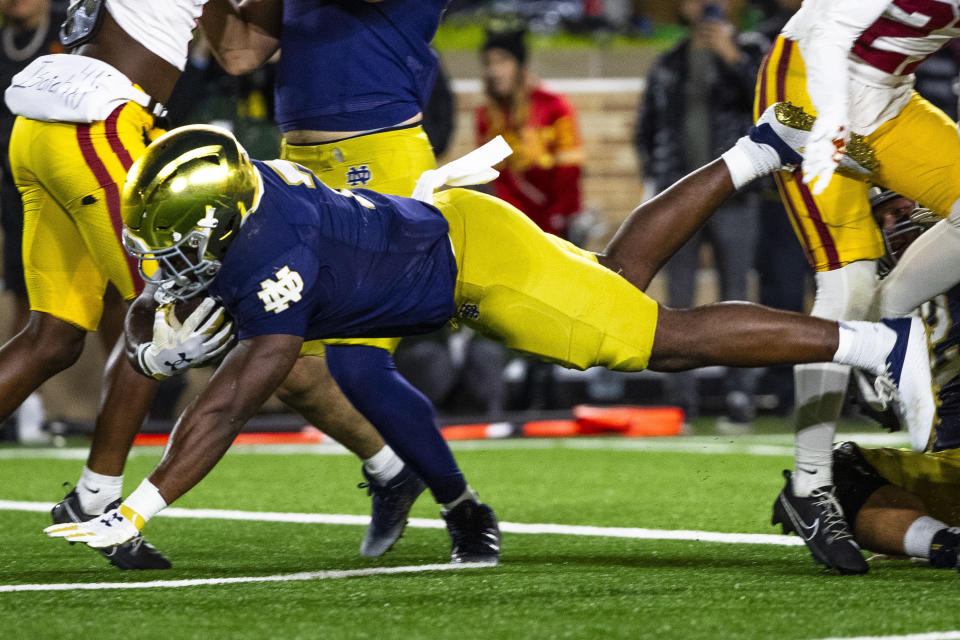 Notre Dame running back Audric Estime (7) dives into the end zone during the first half an NCAA college football game against Southern California Saturday, Oct. 14, 2023, in South Bend, Ind. (AP Photo/Michael Caterina)