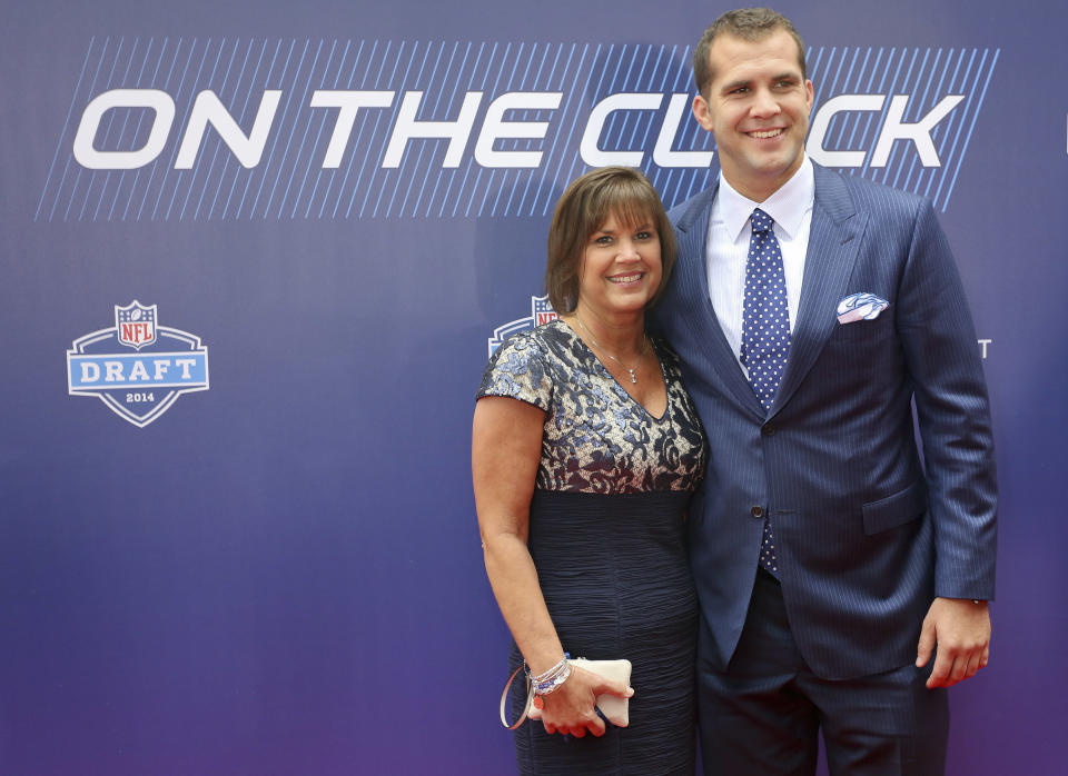 Central Florida quarterback Blake Bortles, right, poses for photos with his mother, Suzy Bortles, upon arriving for the 2014 NFL Draft, Thursday, May 8, 2014, at Radio City Music Hall in New York. (AP Photo/Craig Ruttle)