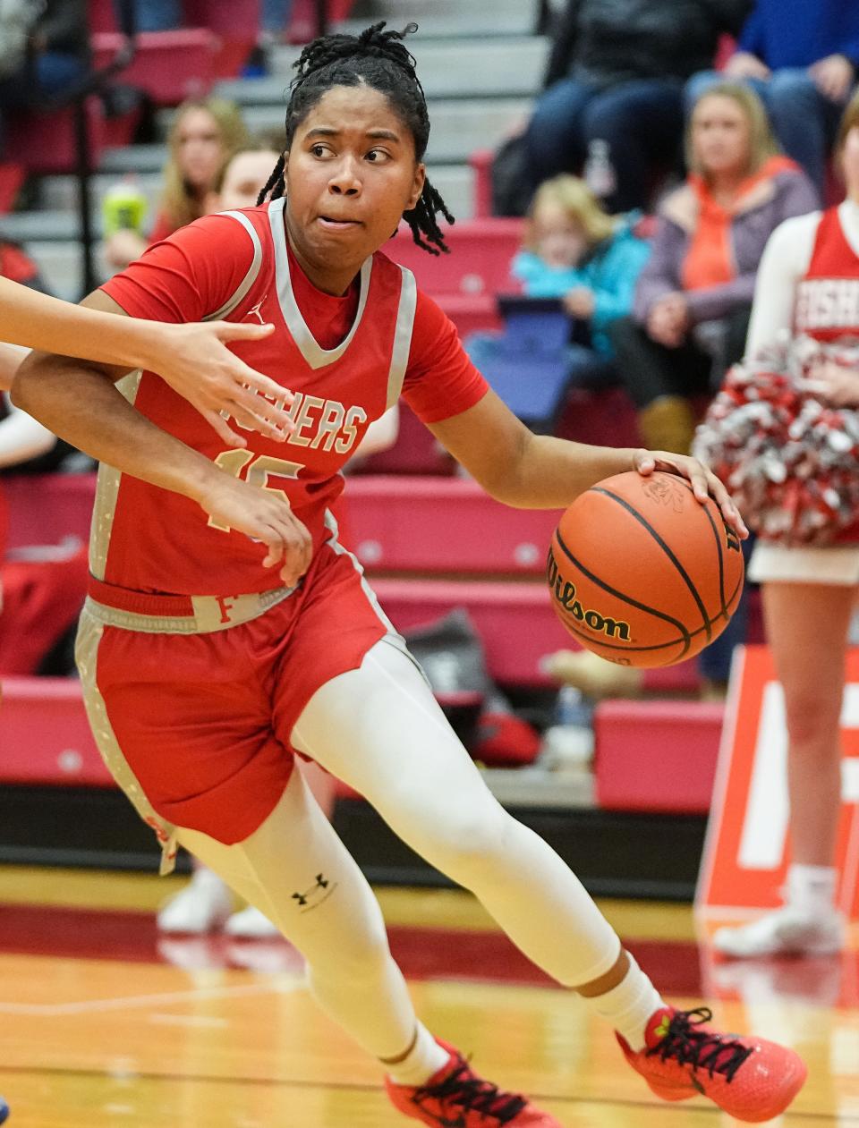 Fishers Tigers Talia Harris (15) rushes up the court Tuesday, Jan. 16, 2024, during the game at Fishers High School in Fishers. The Fishers Tigers defeated the Carmel Greyhounds, 44-37.