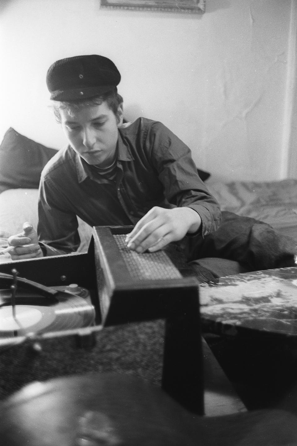 Bob Dylan playing a record