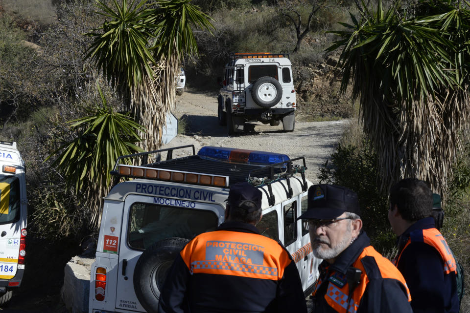 Emergency services look for a 2 year old boy who fell into a well, in a mountainous area near the town of Totalan in Malaga, Spain, Monday, Jan. 14, 2019. More than 100 firefighters and emergency workers in southern Spain are searching for a 2-year-old toddler who fell into a narrow and deep well on Sunday. Rescuers believe the boy fell into the 100-meter-deep well after walking away from his parents. (AP Photo/Gregorio Marrero)