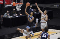 Boston College's Makai Ashton-Langford, bottom left, fouls Villanova's Jermaine Samuels during the second half of an NCAA college basketball game Wednesday, Nov. 25, 2020, in Uncasville, Conn. (AP Photo/Jessica Hill)