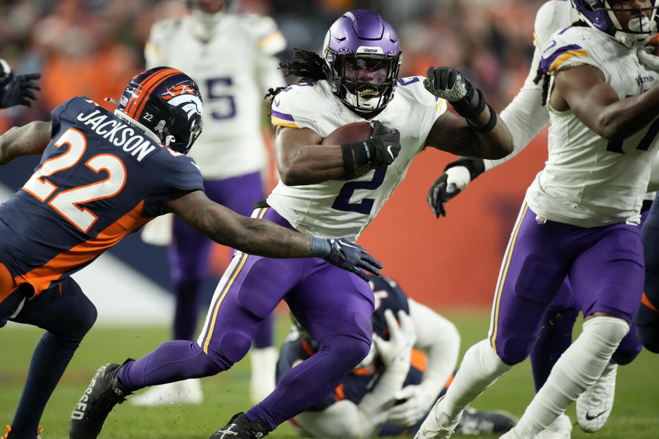 FILE - Minnesota Vikings' Alexander Mattison (2) runs the ball against the Denver Broncos during the second half on an NFL football game, Sunday, Nov. 19, 2023, in Denver. Mattison and the Minnesota Vikings had just taken a tough loss earlier this season when the veteran running back checked his social media accounts and found dozens of hateful and racist messages directed toward him in relative digital anonymity. (AP Photo/David Zalubowski, File)