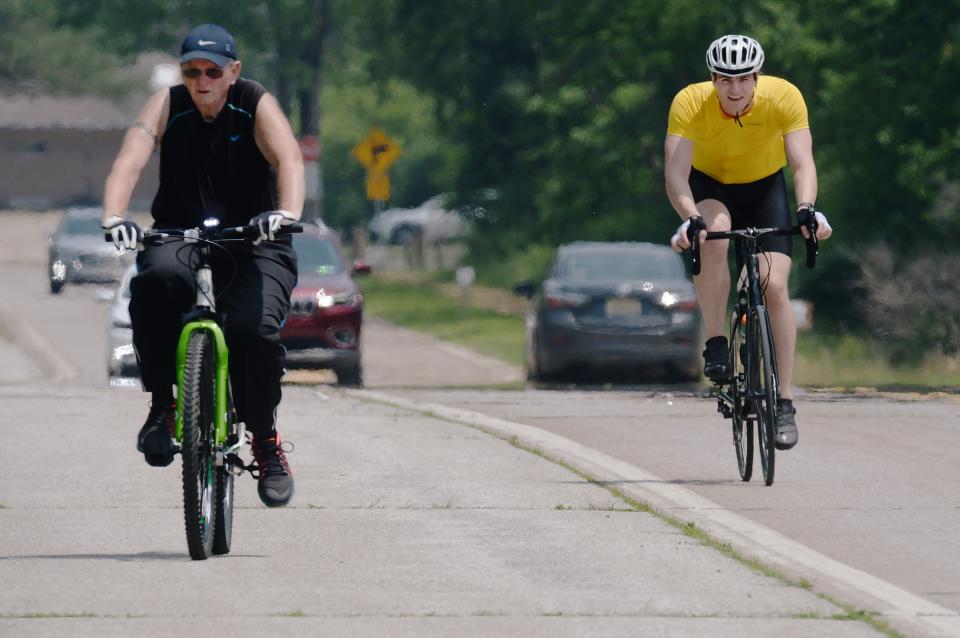 Cyclists use the multipurpose trail, left, and roadway that surrounds Presque Isle State Park in this 2022 file photo. Cycling can be one way people exercise while competing in Step It Up Erie County, an annual fitness competition that starts April 1.