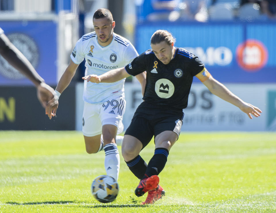 CF Montreal's Samuel Piette, right, challenges Chicago Fire's Stanislav Ivanov during first-half MLS soccer match action in Montreal, Sunday, Sept. 19, 2021. (Graham Hughes/The Canadian Press via AP)