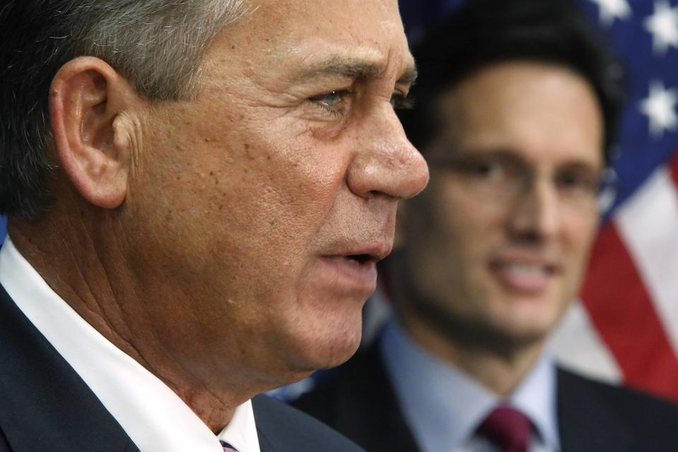 Boehner stands next to Cantor as he holds a news conference after a House Republican caucus meeting at the U.S. Capitol in Washington