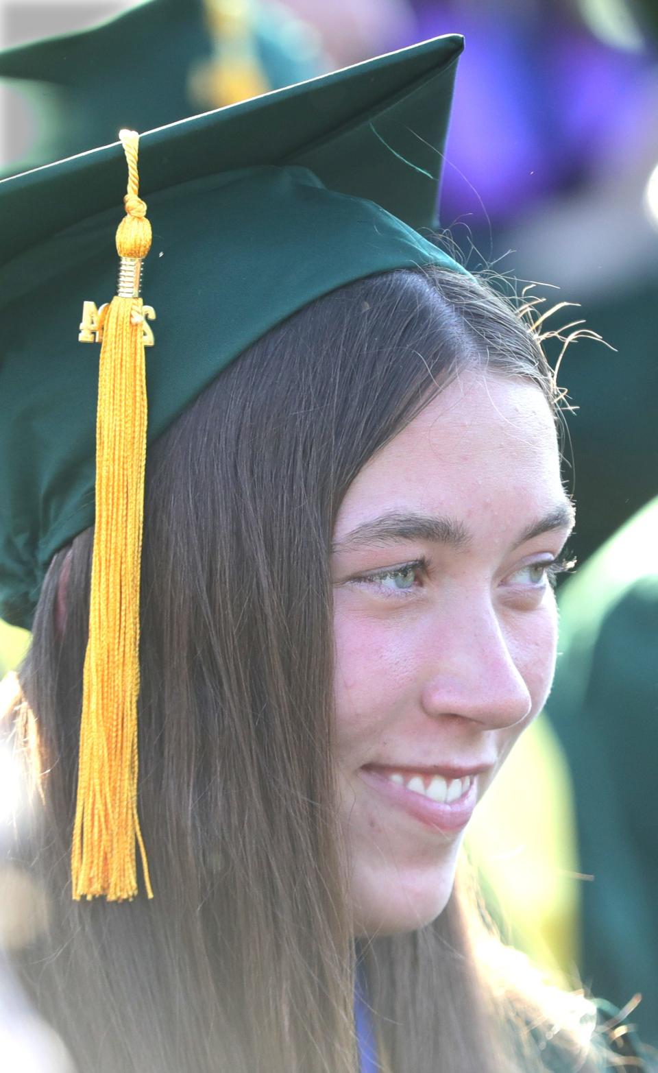 St. Vincent-St. Mary valedictorian Anne Rea looks out across the graduation ceremony Tuesday in Akron.