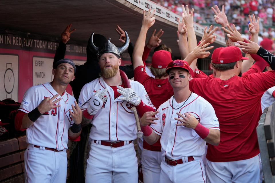 CINCINNATI, OHIO - JULY 22: Jake Fraley #27 of the Cincinnati Reds poses for a photo with teammates after hitting a solo home run in the sixth inning against the Arizona Diamondbacks at Great American Ball Park on July 22, 2023 in Cincinnati, Ohio.