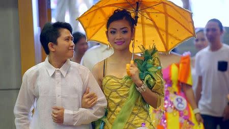 Filipina domestic helper Cyril Goliava (C) is seen in the documentary 'Sunday Beauty Queen' film during an annual beauty peageant in Hongkong in this undated handout image. Voyage Studios/Handout via Reuters