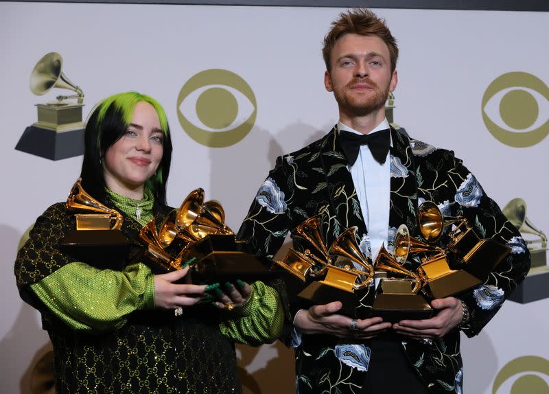 62nd Grammy Awards – Photo Room – Los Angeles, California, U.S., January 26, 2020 - Billie Eilish and Finneas O'Connell pose backstage with her awards