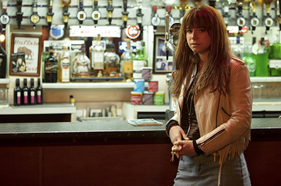 This image released by Neon shows actress Jessie Buckley in a scene from the film, "Wild Rose." Buckley stars as a fiery, working-class Glasgow single mother, just out of prison, who dreams of becoming a country music star. (Neon via AP)