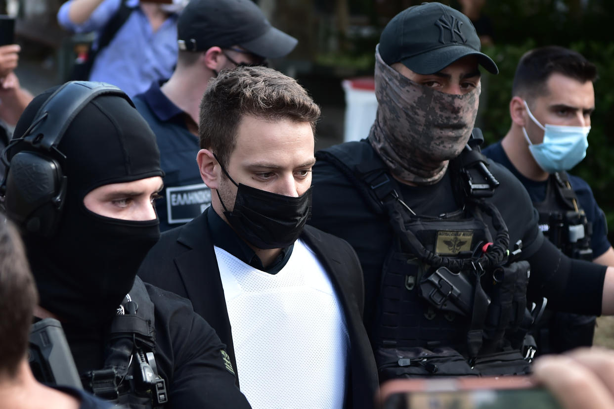 ATHENS, GREECE - JUNE 18: Babis Anagnostopoulos leaves the court escorted by police on June 18, 2021 in Athens, Greece. On June 17th Babis Anagnostopoulos, a 32-year-old pilot, confessed to having killed his British wife Caroline Crouch on May 11th, after Greek police disproved his initial claim that she had been killed during a robbery. (Photo by Milos Bicanski/Getty Images)