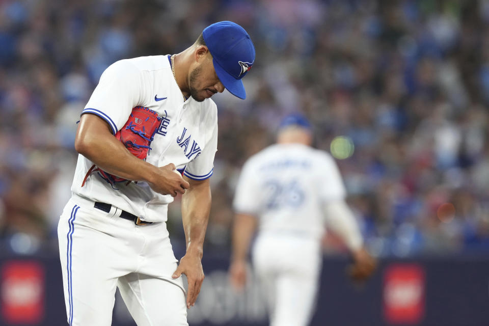 Toronto Blue Jays starting pitcher Jose Berrios looks down as he works against the Chicago Cubs during the fourth inning of a baseball game Friday, Aug. 11, 2023, in Toronto. (Chris Young/The Canadian Press via AP)