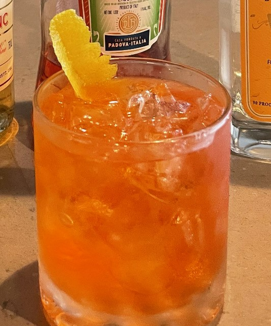 A Pink Negroni from The Terrace Tavern in Long Beach, with local Sourland Spirits Gin, Compari, Lillet and a lemon peel.