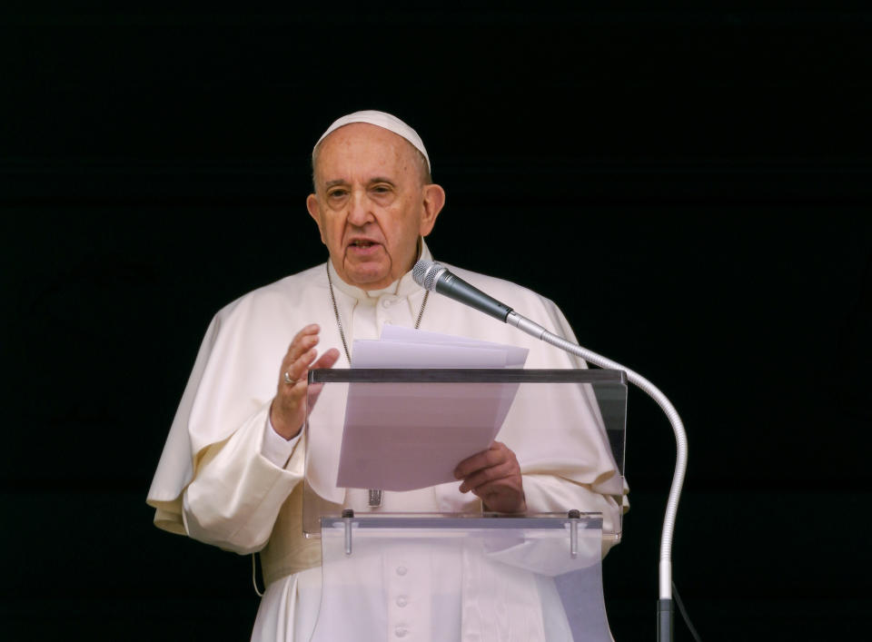 Pope Francis speaks from the window of his studio overlooking St. Peter's Square at The Vatican to a crowd of faithful and pilgrims gathered for the Sunday Angelus noon prayer, Sunday, June 6, 2021. Pope Francis has expressed sorrow over the discovery in Canada of the remains of 215 boarding school students but didn't offer the apology sought by the Canadian prime minister. Francis in public remarks on Sunday called on political and church authorities to work to shed light “on this sad affair” and to foster healing. (AP Photo/Domenico Stinellis)