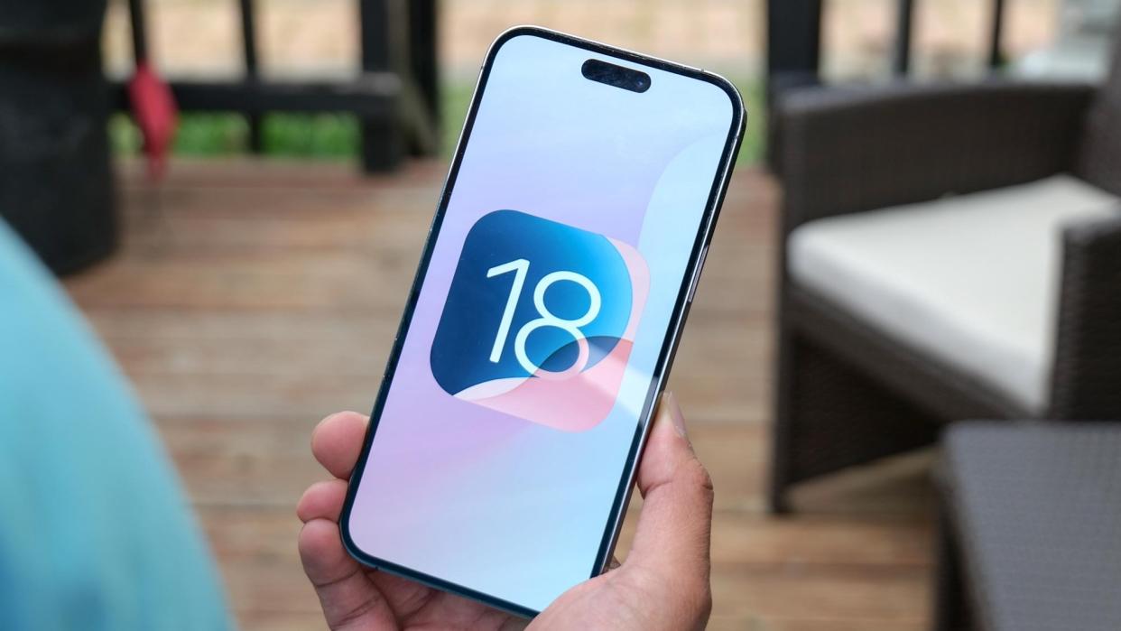  IOS 18 logo on an iPhone 15 Pro. 