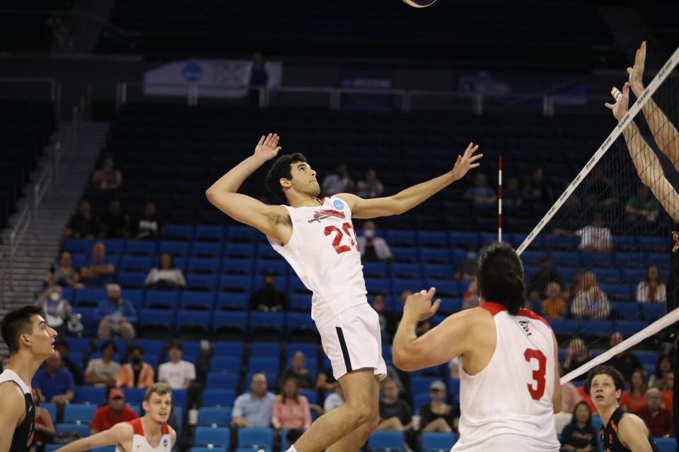 NGU freshman Michael de la Cruz rises up to spike the volleyball against Princeton on May 1, 2022 at Pauley Pavilion on the campus of UCLA.