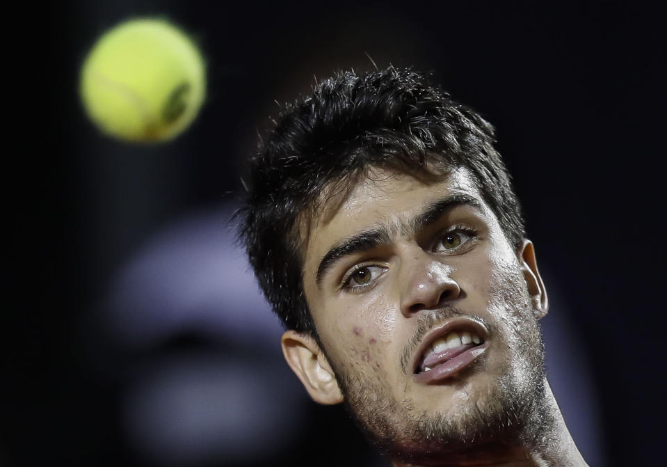 Carlos Alcaraz of Spain returns the ball to Fabio Fognini of Italy during a match of the Rio Open Tennis tournament in Rio de Janeiro, Brazil, Thursday, Feb. 23, 2023. (AP Photo/Bruna Prado)