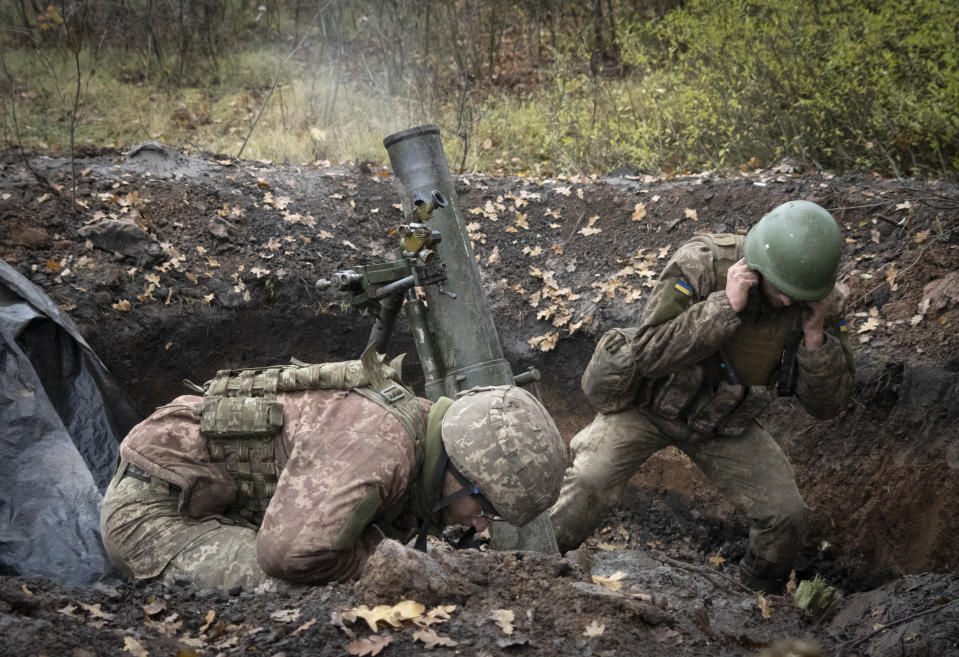 Ukrainian soldiers fire a mortar in the front line near Bakhmut, in the Donetsk region, Ukraine, Thursday, Oct. 27, 2022. (AP Photo/Efrem Lukatsky)