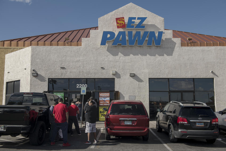 Customers wait in line outside an EZPawn on April 13, 2020, in Las Vegas. (Photo: BRIDGET BENNETT FOR HUFFPOST)