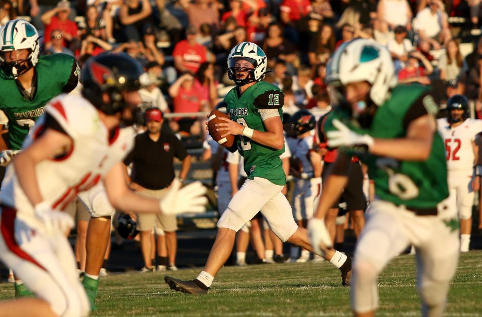 West Branch quarterback Dru Deshields looks down field during their game against Canfield Friday, August 19, 2022 at Clinton Heacock Stadium.