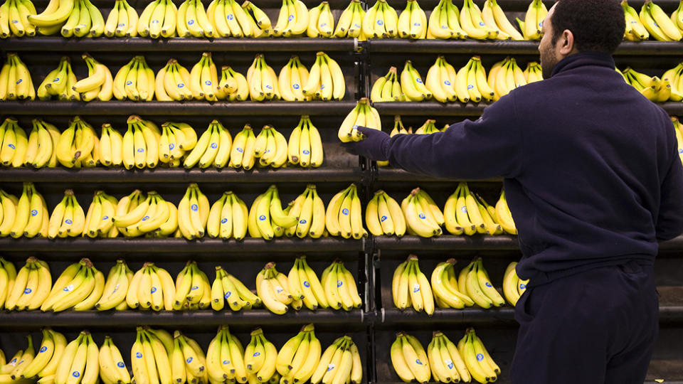 Bananas are seen stacked on a Woolworths' shelf.