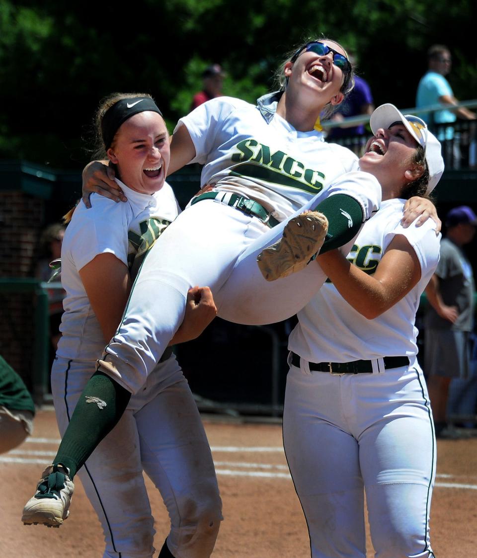 St. Mary's Catholic Central pitcher Meghan Beaubien is lifted by her teammates Kelsey Barron and Morgan Antonelli after Beaubien threw a perfect game as SMCC beat Gladstone 13-0 in the Division 3 state semifinal game on June 17, 2016 at Michigan State University. Beaubien went onto throw another perfect game to win her second Division 3 state title over Grandville Calvin Christian.