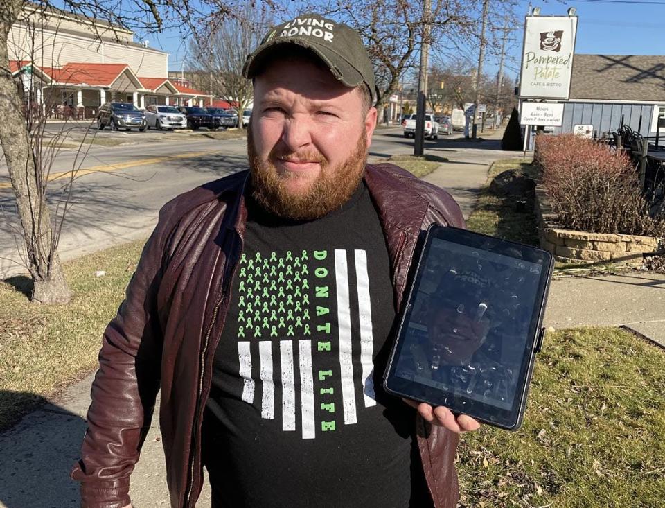 Eli Vendley, 31, donated one of his kidneys Jan. 6 to fellow Linesville resident Michael Auen, whose image is shown on Vendley's computer tablet. Vendley said the donation has spurred him to devote his life to raising organ donation awareness.