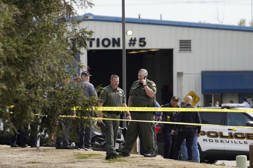 Authorities from various agencies gather at the command post next to local fitness center and library where a lockdown occurred in response to a shooting in Roseville, Calif., Thursday, April 6, 2023. At least three people have been hospitalized.(AP Photo/Rich Pedroncelli)