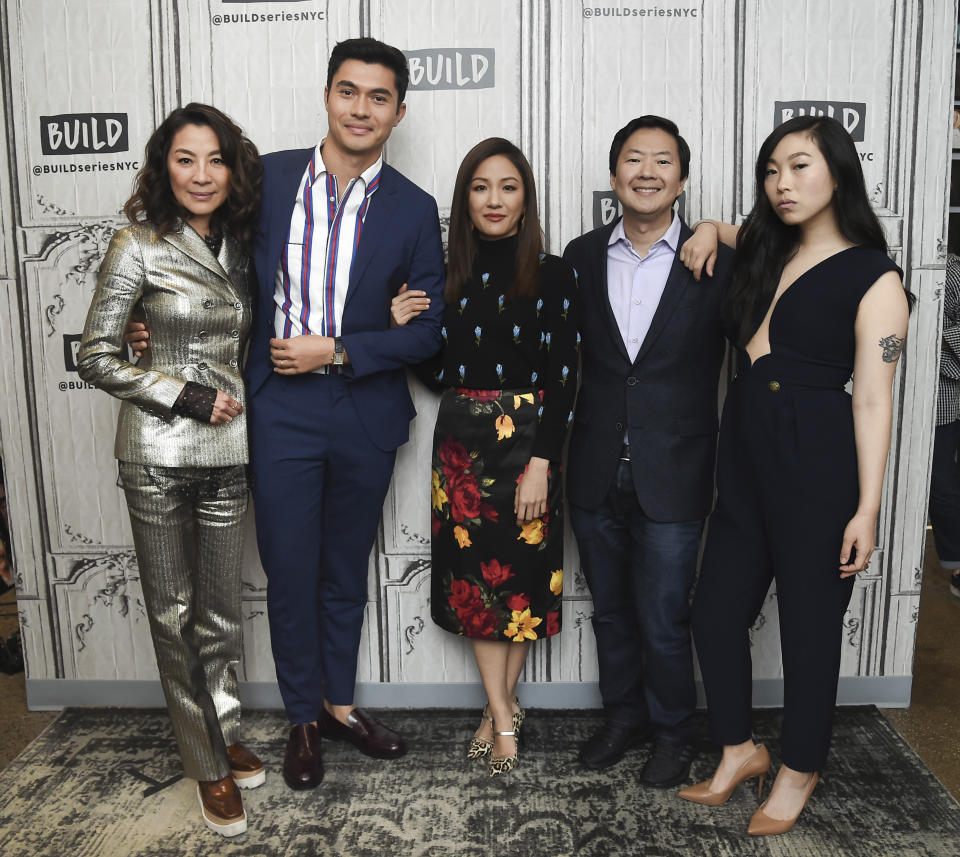 FILE: In this Aug. 14, 2018, file photo, Actors Michelle Yeoh, from left, Henry Golding, Constance Wu, Ken Jeong and Awkwafina participate in the BUILD Speaker Series to discuss the film "Crazy Rich Asians" at AOL Studios in New York. The craze for “Crazy Rich Asians” is hitting Asia, with a premiere in Singapore to be followed by openings in several neighboring countries later this week. Much of the movie was set in the wealthy city-state and the red carpet premiere Tuesday night for the over-the-top romantic comedy was expected to draw an enthusiastic crowd after its box-office bonanza in the U.S. Critics say its satirical portrayal of an uber-rich Singaporean Chinese family fails to showcase the city’s ethnic diversity. (Photo by Evan Agostini/Invision/AP, File)