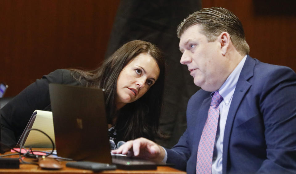 Defense attorneys Jennifer Frese, left, and Chad Frese talk as Chad Frese cross examines Mollie Tibbetts' boyfriend Dalton Jack during the trial of Cristhian Bahena Rivera at the Scott County Courthouse in Davenport, Iowa, on Wednesday, May 19, 2021. Rivera is charged with first-degree murder in the death of Tibbetts. (Jim Slosiarek/The Gazette via AP, Pool)