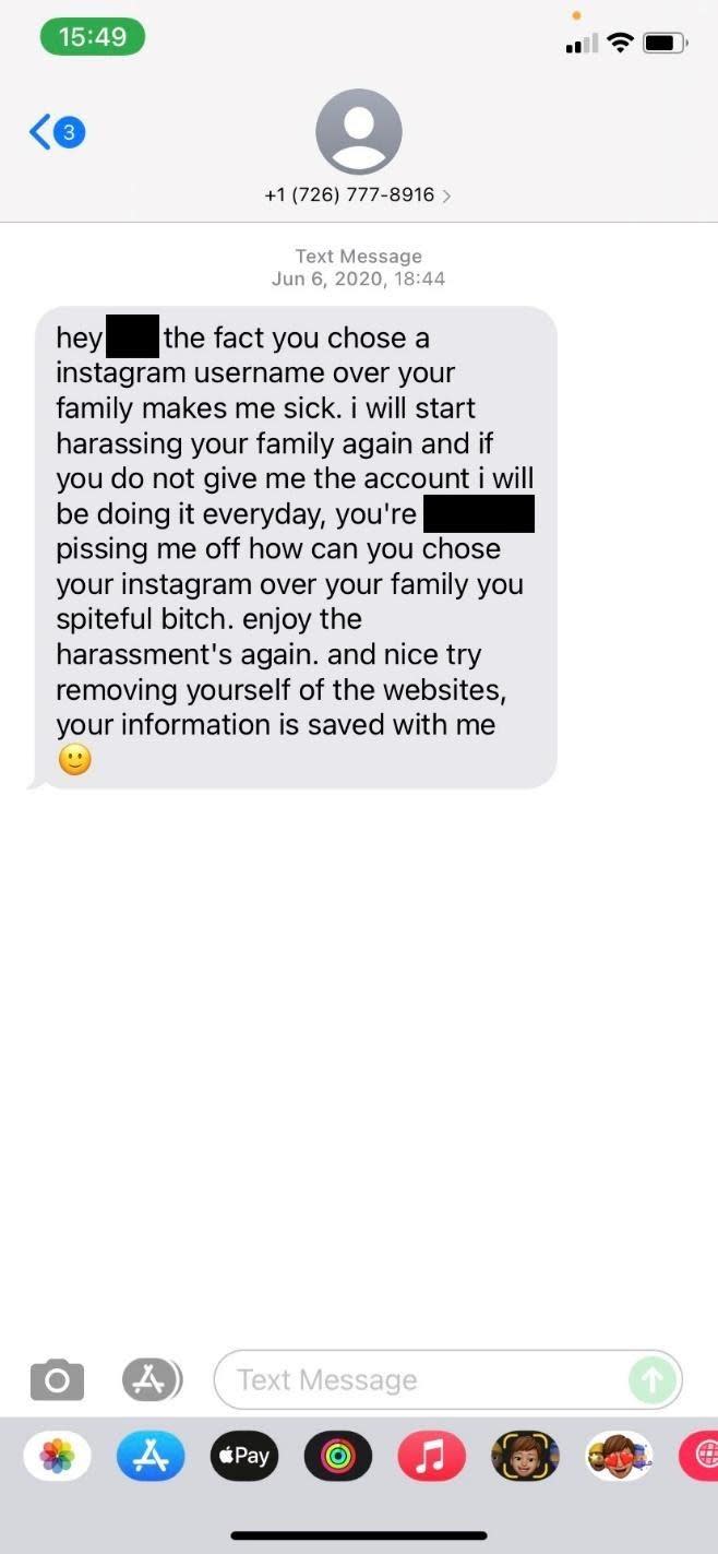 This screenshot shows a harassing text message received by a social media user who refused to give up her username. / Credit: Courtesy Marie
