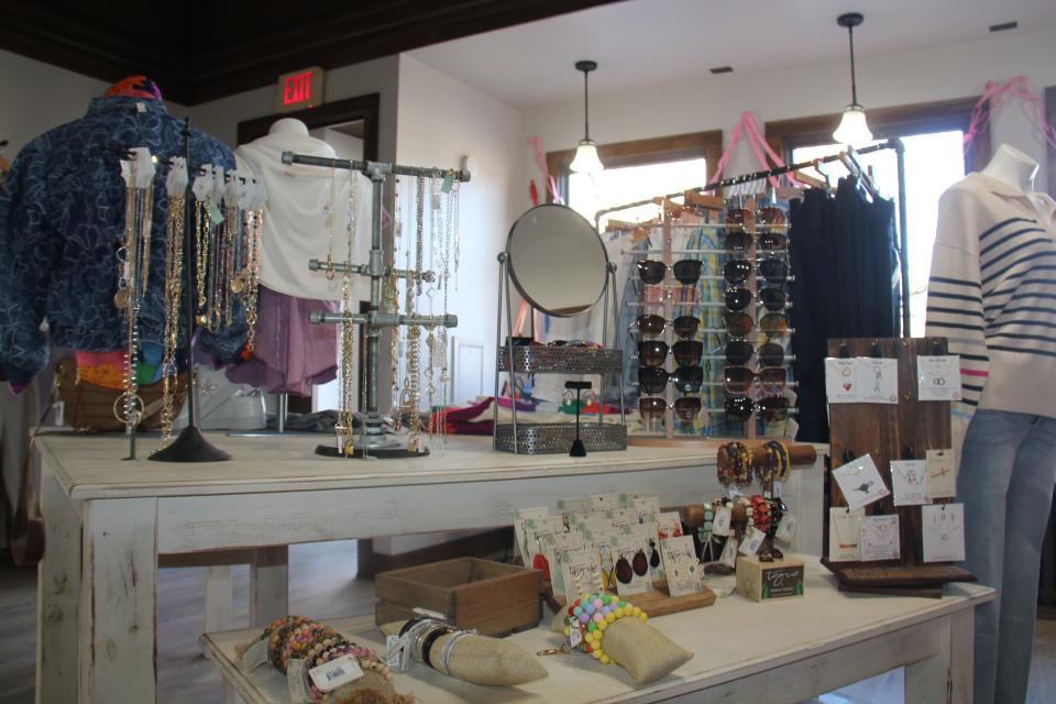 Jewelry and sunglasses are on display at Azalea Lane Boutique.