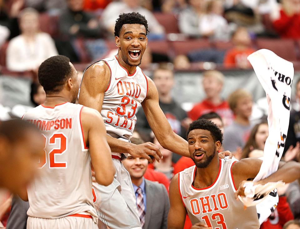 Ohio State Buckeyes center Trevor Thompson (32), Ohio State Buckeyes forward Keita Bates-Diop (33) and Ohio State Buckeyes guard JaQuan Lyle (13) celebrate on the bench as the game winds down against Rutgers at Value City Arena on January 13, 2016. (Chris Russell)